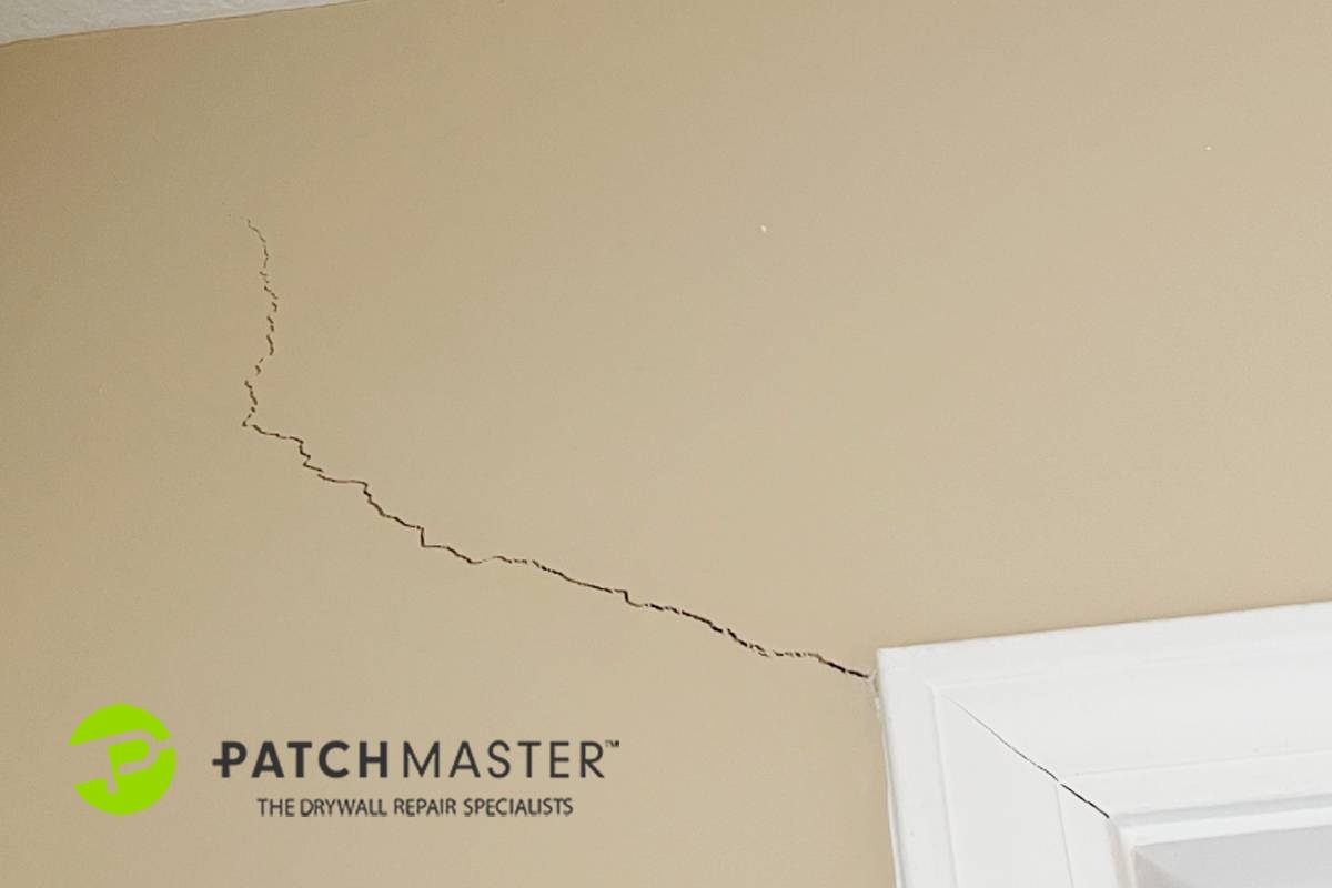 Cracked drywall  near a door